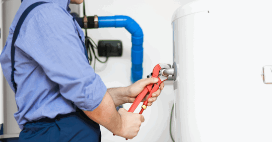 plumber fixing a water heater