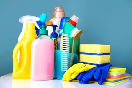 A combination of cleaning supplies sit on a counter