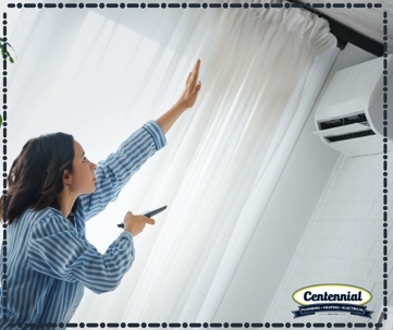 A woman holding out her hand on the AC