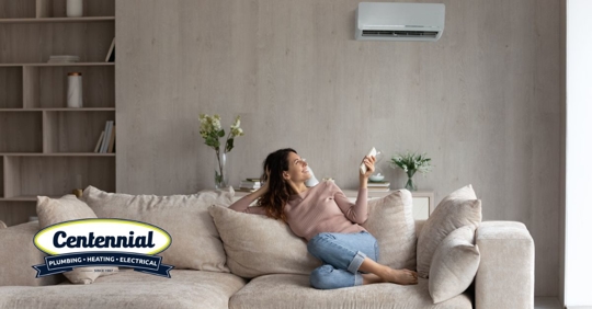 Woman sitting on couch.