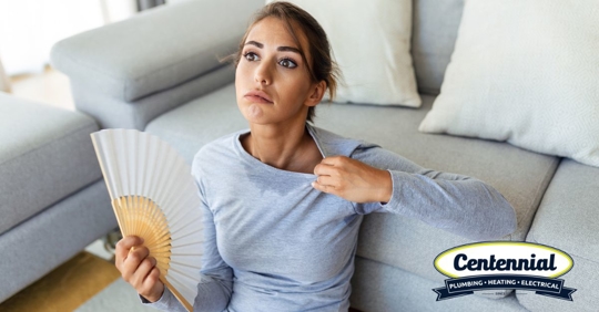 Woman holding fan.